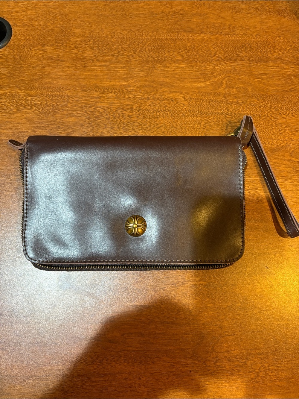 Dark Brown Leather Wristlet Clutch with Decorative Medallion